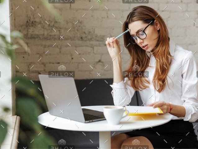 demo-attachment-407-thoughtful-business-woman-indoors-using-laptop-P5HYUQX