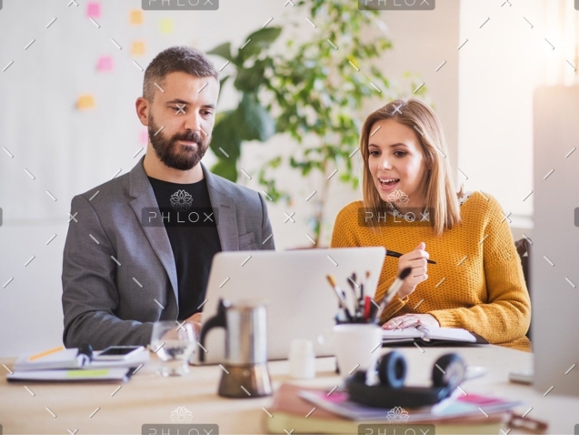 demo-attachment-408-two-business-people-with-wheelchair-in-the-office-P7XLSBC